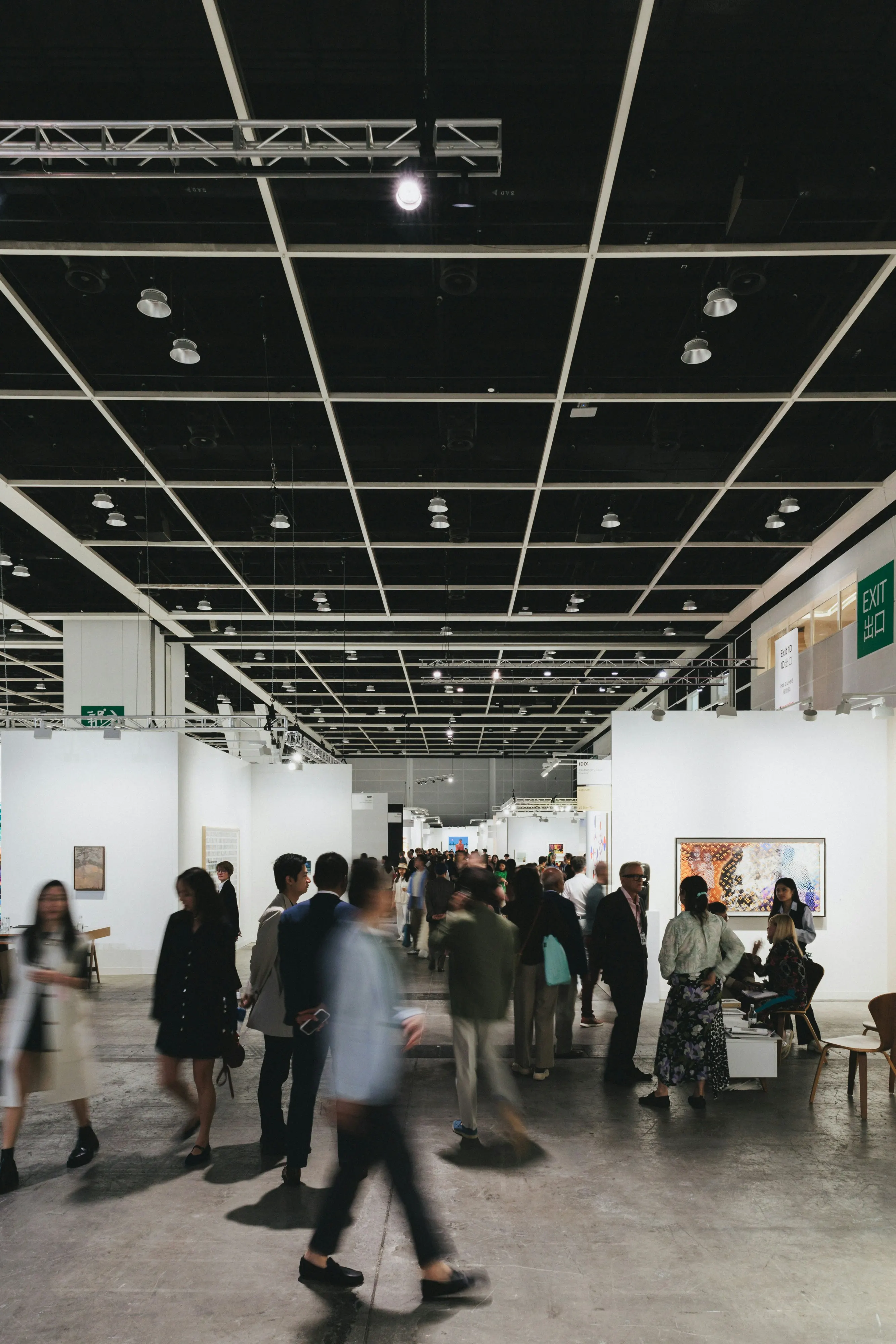 Visitors exploring a contemporary art fair